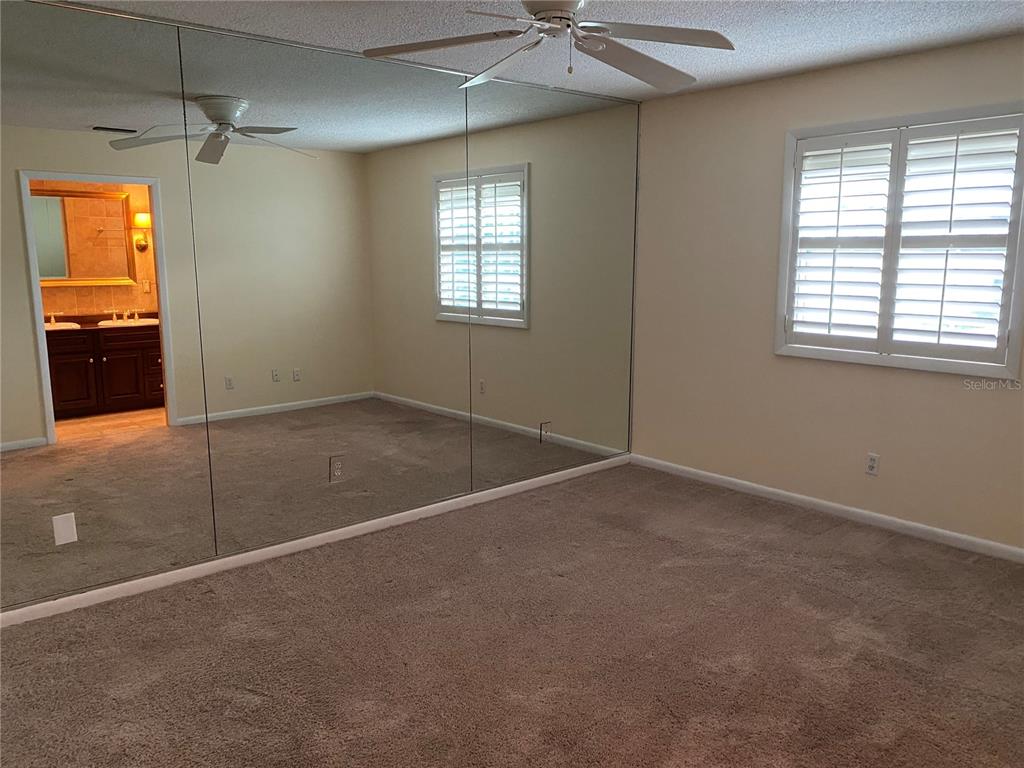 1500 Gay Road, Unit 17D Winter Park, FL 32789 - Photo 17 of 34 an empty room with windows and closet