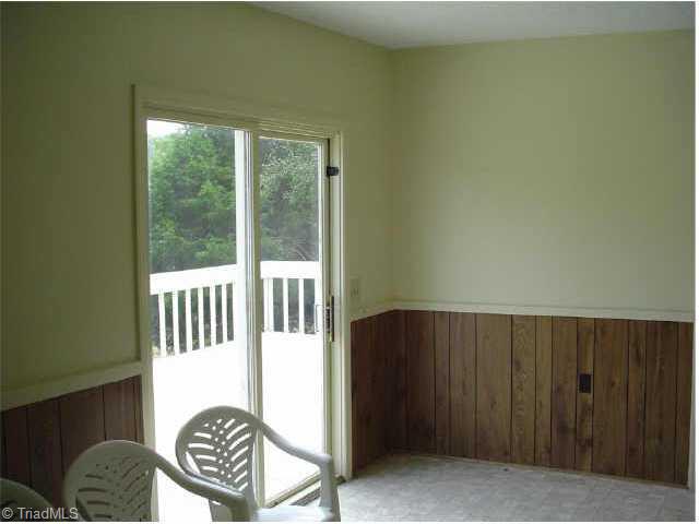 1192 Dodson Mill Road Pilot Mountain, NC 27041 - Photo 7 of 9 Other. Sunroom has patio doors that open onto the deck.