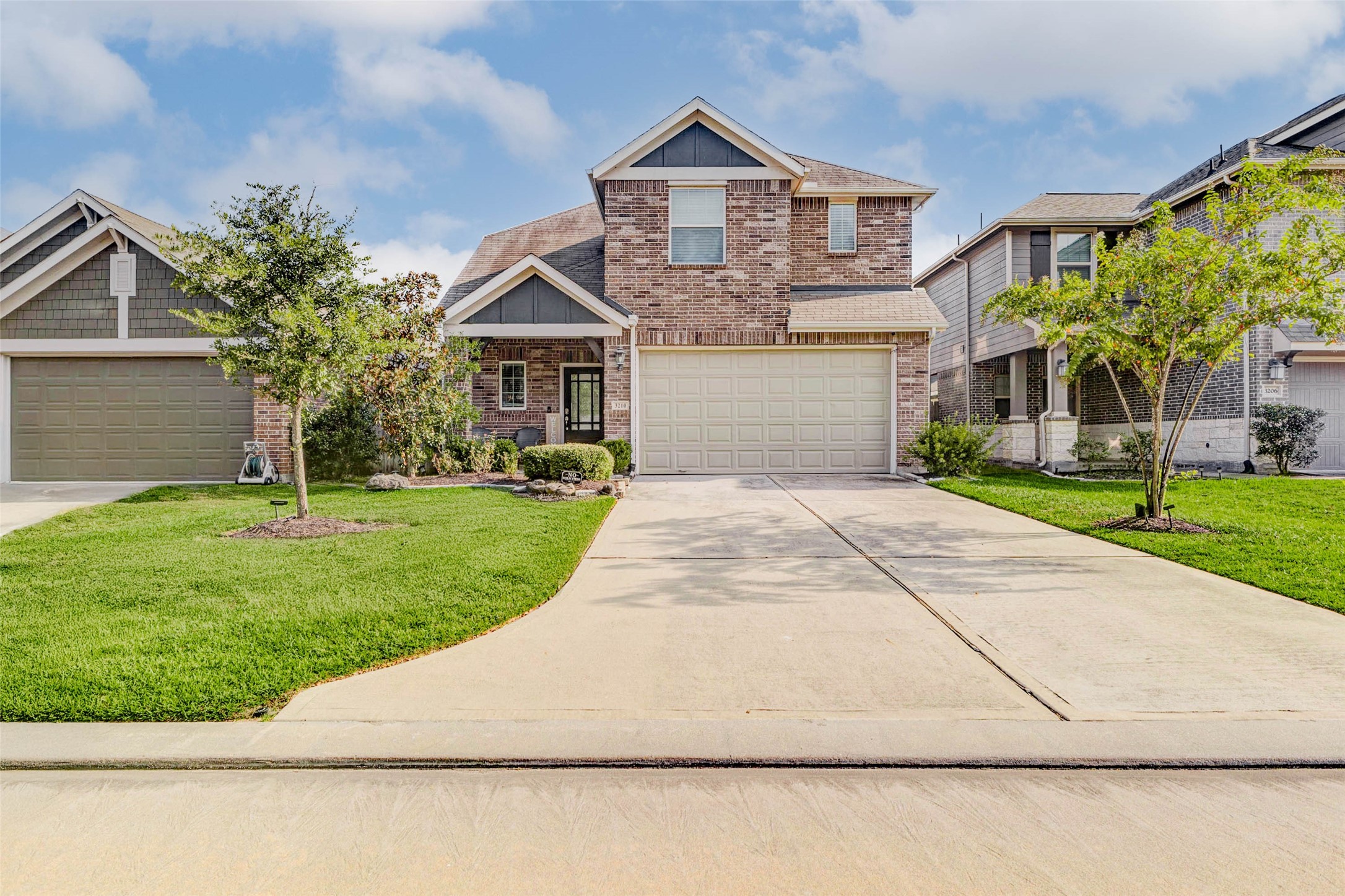 3210 Montclair Orchard Trace Spring, TX 77386 - Photo 2 of 38 a front view of a house with a yard and garage