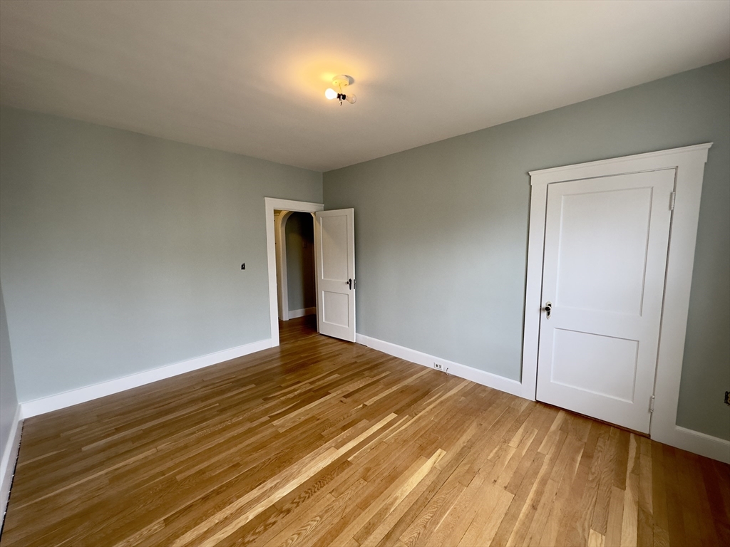 56 South Main Street Uxbridge, MA 01569 - Photo 6 of 14 a view of an empty room and wooden floor
