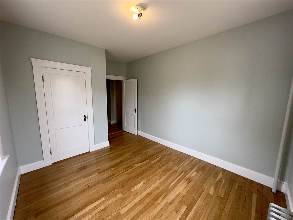 56 South Main Street Uxbridge, MA 01569 - Photo 8 of 14 a view of empty room with wooden floor