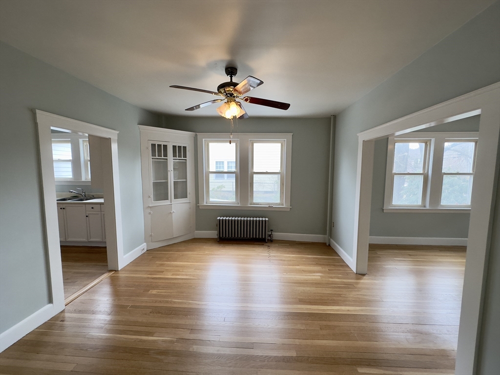 56 South Main Street Uxbridge, MA 01569 - Photo 10 of 14 a view of n empty room with window and wooden floor
