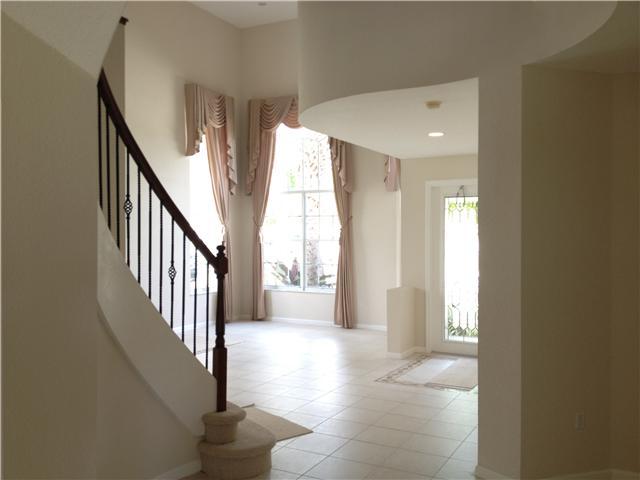 2023 Reston Circle Royal Palm Beach, FL 33411 - Photo 17 of 23 a view of an entryway with wooden floor and windows