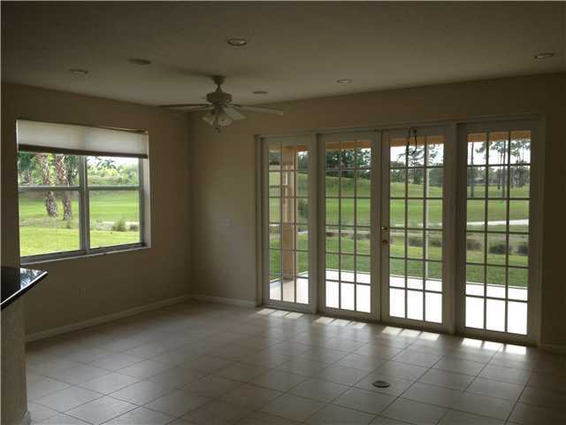 2023 Reston Circle Royal Palm Beach, FL 33411 - Photo 2 of 23 a view of an empty room with a window