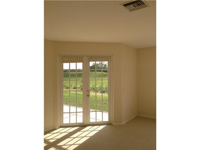 2023 Reston Circle Royal Palm Beach, FL 33411 - Photo 4 of 23 a view of an empty room with a window
