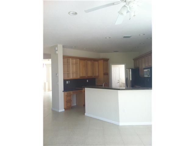 2023 Reston Circle Royal Palm Beach, FL 33411 - Photo 10 of 23 a view of a hallway with stairs