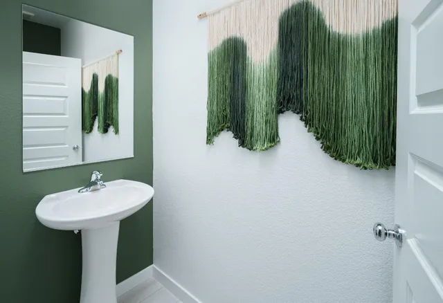 a bathroom with a sink and mirror