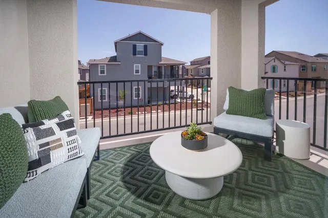 a living room with furniture and a table