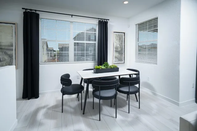 a view of a dining room with furniture window and outside view