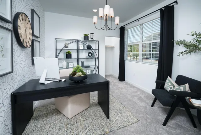 a view of a workspace with furniture