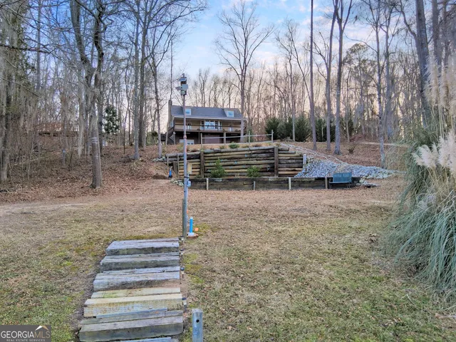 a backyard of a house with lots of green space