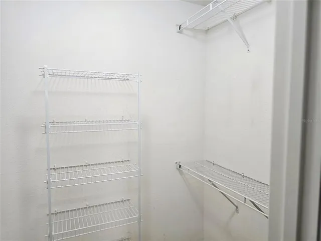 a view of an empty walk in closet