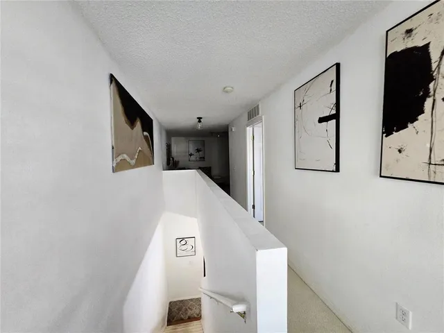 a view of a hallway with front door