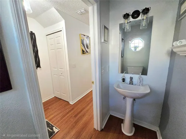 a bathroom with a sink a mirror and shower