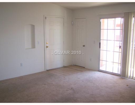 4730 East Craig Road, Unit 2095 Las Vegas, NV 89115 - Photo 3 of 14 Living Room. llIVING ROOM WITH BALCONY VIEW 1