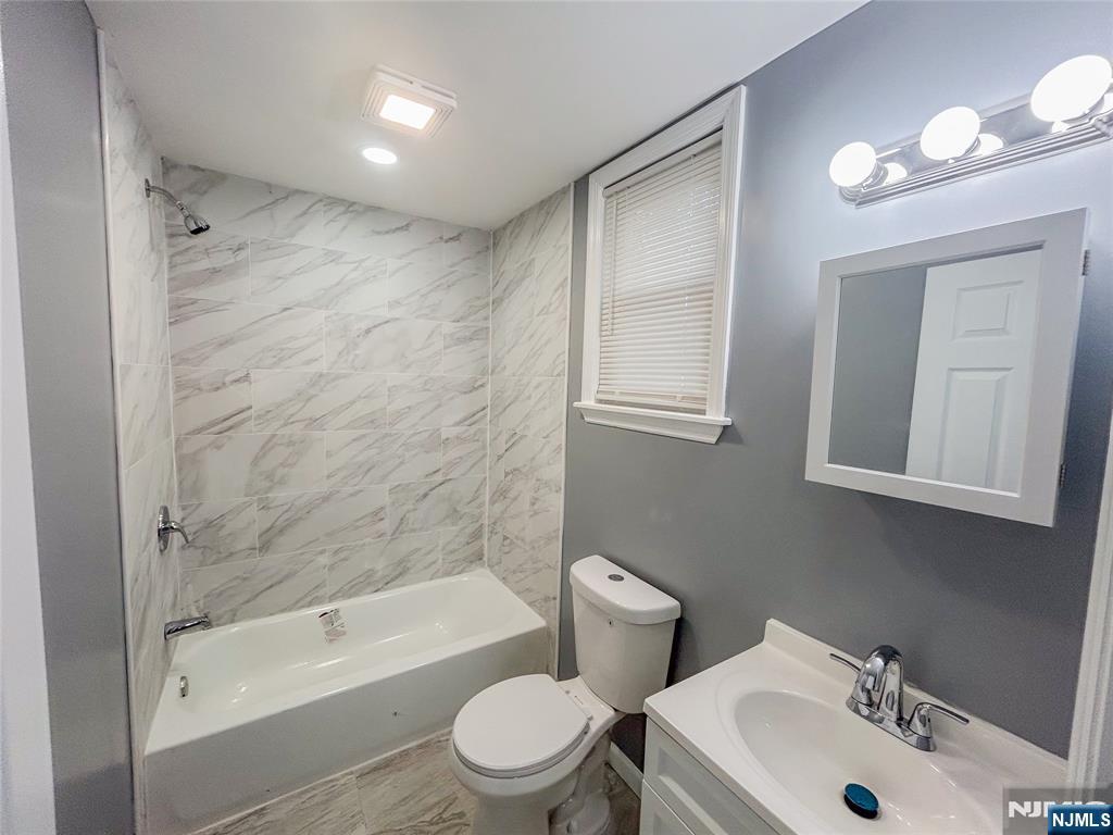 676 South 20th Street Newark, NJ 07103 - Photo 25 of 38 a bathroom with a sink toilet and shower