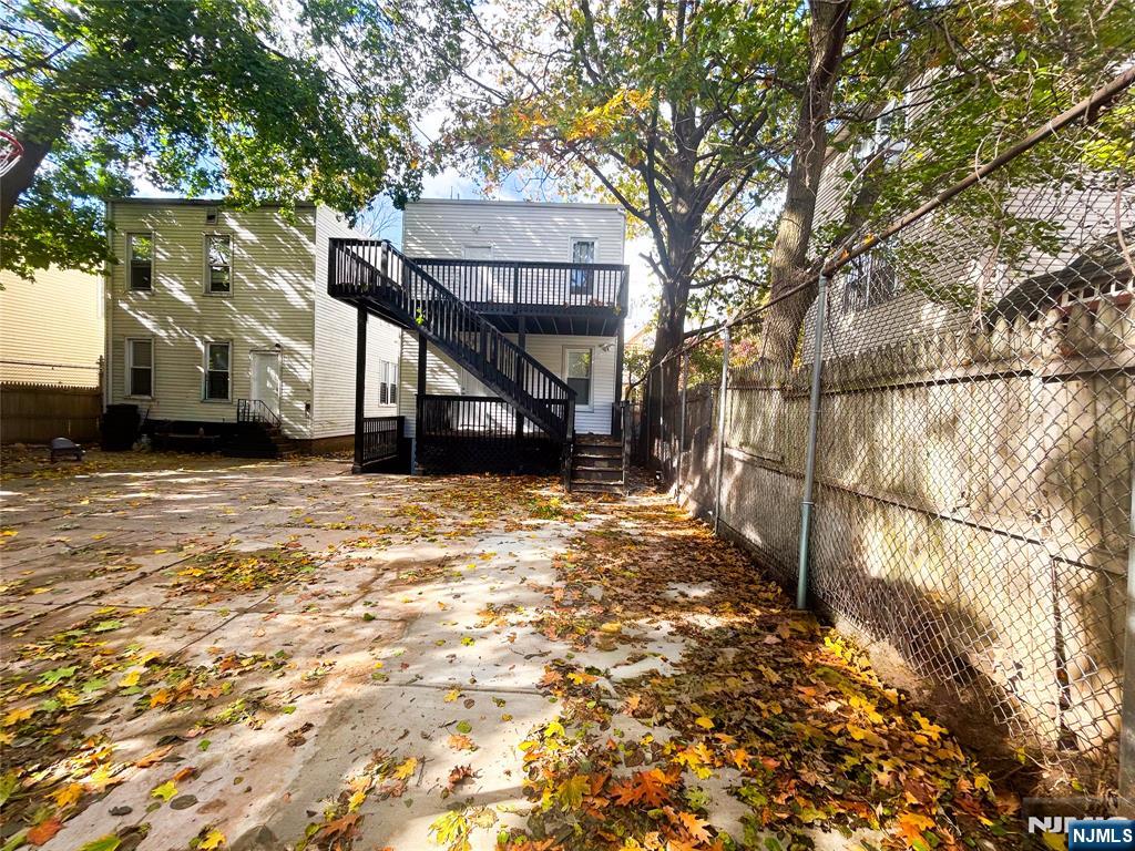 676 South 20th Street Newark, NJ 07103 - Photo 36 of 38 a view of a house with a snow in the yard