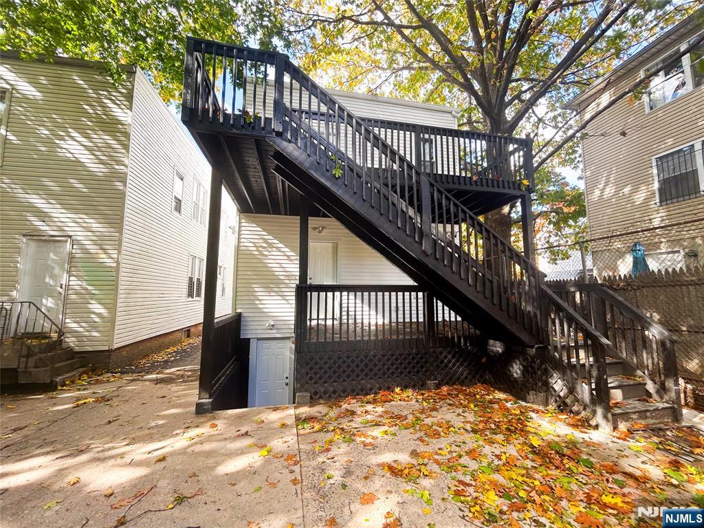 676 South 20th Street Newark, NJ 07103 - Photo 37 of 38 a view of wooden house with a large tree