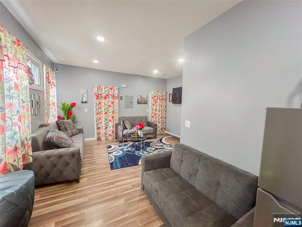 676 South 20th Street Newark, NJ 07103 - Photo 4 of 38 a living room with furniture and a flat screen tv