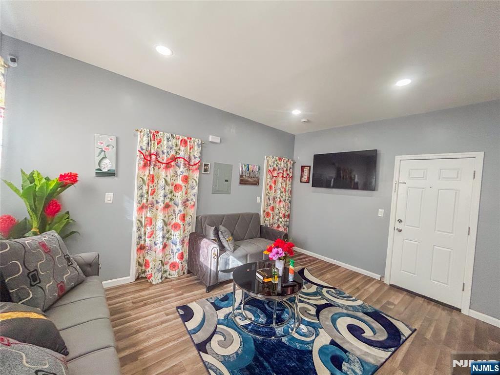 676 South 20th Street Newark, NJ 07103 - Photo 5 of 38 a living room with furniture and a flat screen tv