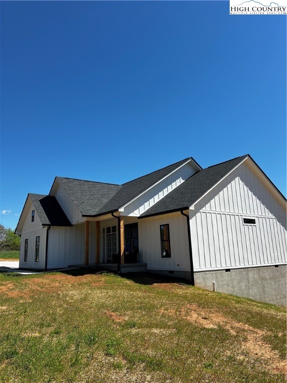 3991 Poplar Springs Road Elkin, NC 28621 - Photo 2 of 45 a front view of a house with a yard