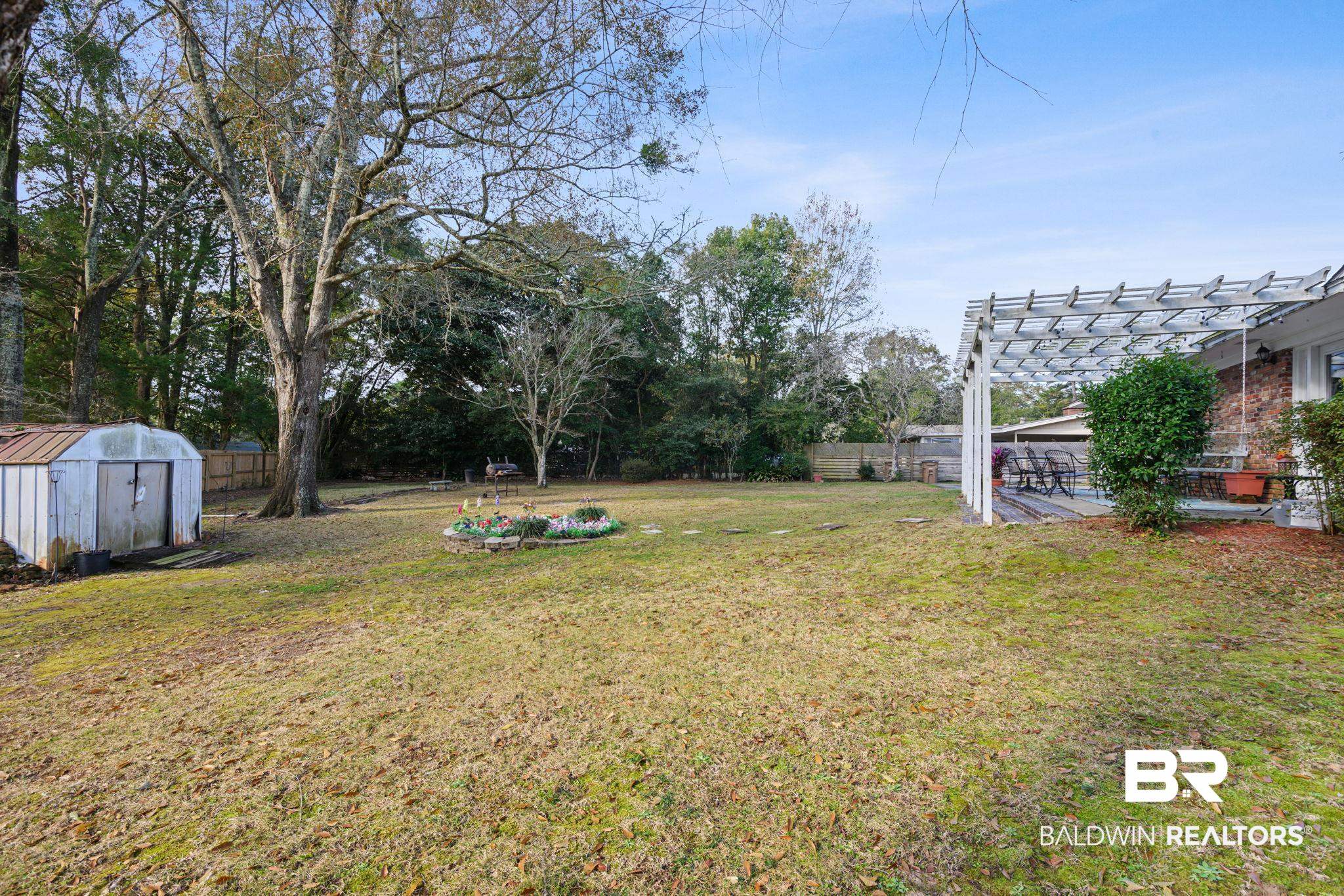 4105 Libby Drive Mobile, AL 36693 - Photo 26 of 26 View of yard with a pergola and a storage shed