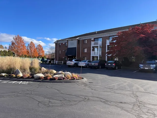 a view of a patio with couches and city view