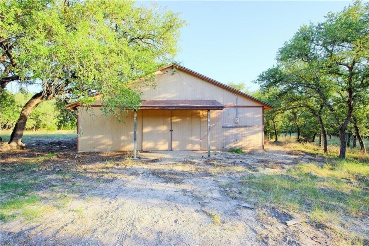 4717 Sam Bass Road Round Rock, TX 78681 - Photo 31 of 37 a view of a house with backyard and a tree