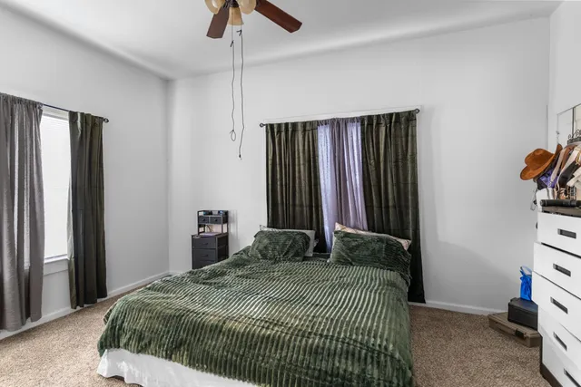 a workspace with furniture and window in a room
