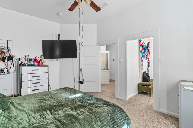a white toilet sitting next to a bathroom sink