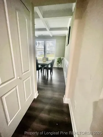 a large kitchen with stainless steel appliances wooden cabinets a stove top oven a sink and dishwasher