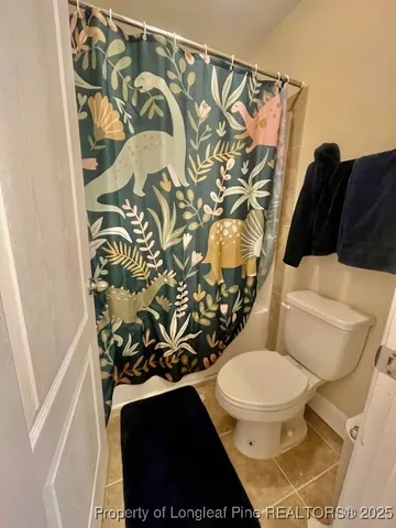 a bedroom with a bed and a dresser in it