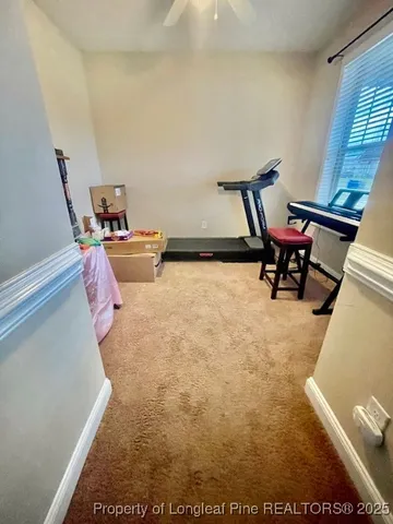 a dining room with furniture and chandelier