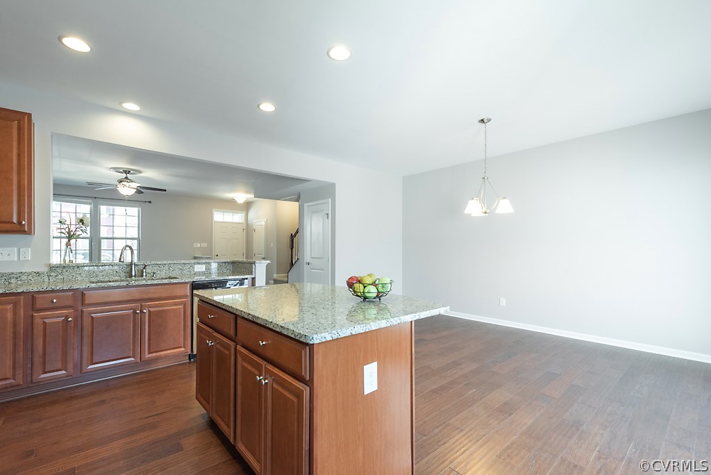 5613 Riverside Heights Way Richmond, VA 23225 - Photo 11 of 41 a kitchen with granite countertop cabinets a sink and appliances
