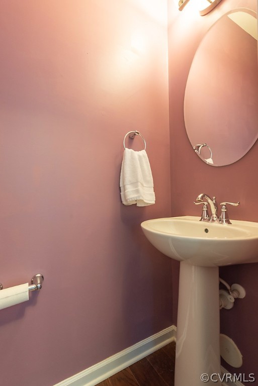 5613 Riverside Heights Way Richmond, VA 23225 - Photo 17 of 41 a bathroom with a sink and mirror