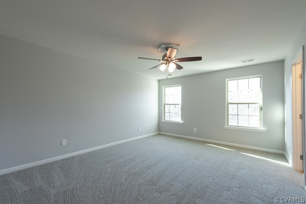 5613 Riverside Heights Way Richmond, VA 23225 - Photo 19 of 41 a view of an empty room with a window