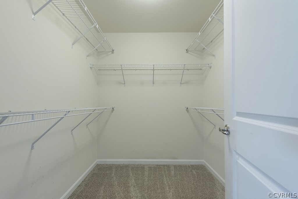 5613 Riverside Heights Way Richmond, VA 23225 - Photo 22 of 41 a view of a room with racks on the wall