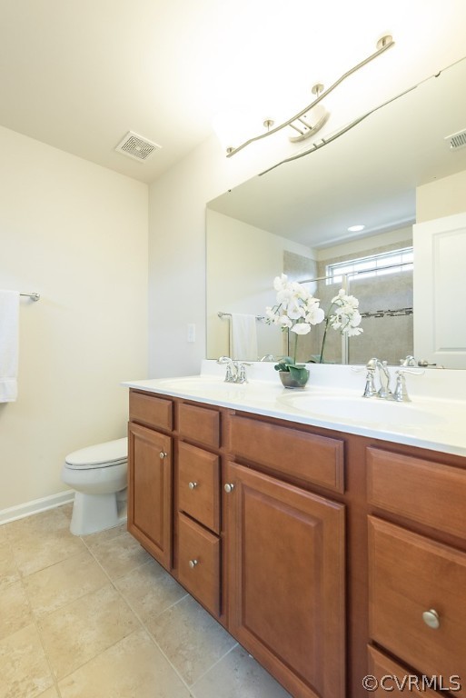 5613 Riverside Heights Way Richmond, VA 23225 - Photo 24 of 41 a bathroom with a toilet sink and mirror
