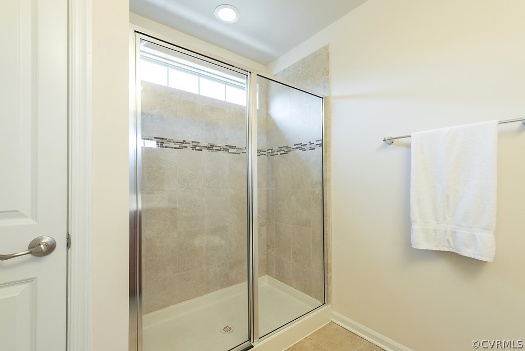 5613 Riverside Heights Way Richmond, VA 23225 - Photo 25 of 41 a bathroom with a glass shower door