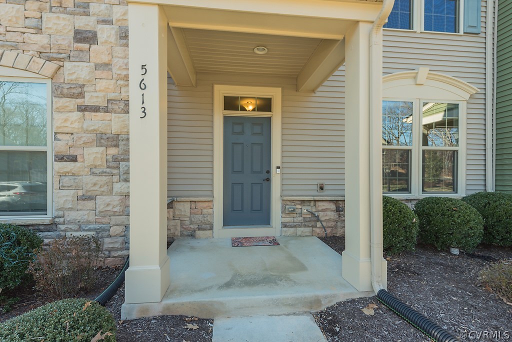 5613 Riverside Heights Way Richmond, VA 23225 - Photo 3 of 41 a view of a brick house with outdoor space