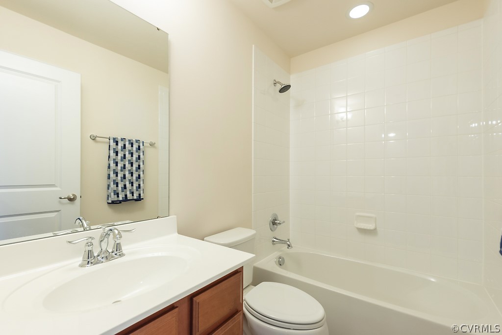 5613 Riverside Heights Way Richmond, VA 23225 - Photo 31 of 41 a bathroom with a sink a toilet and shower