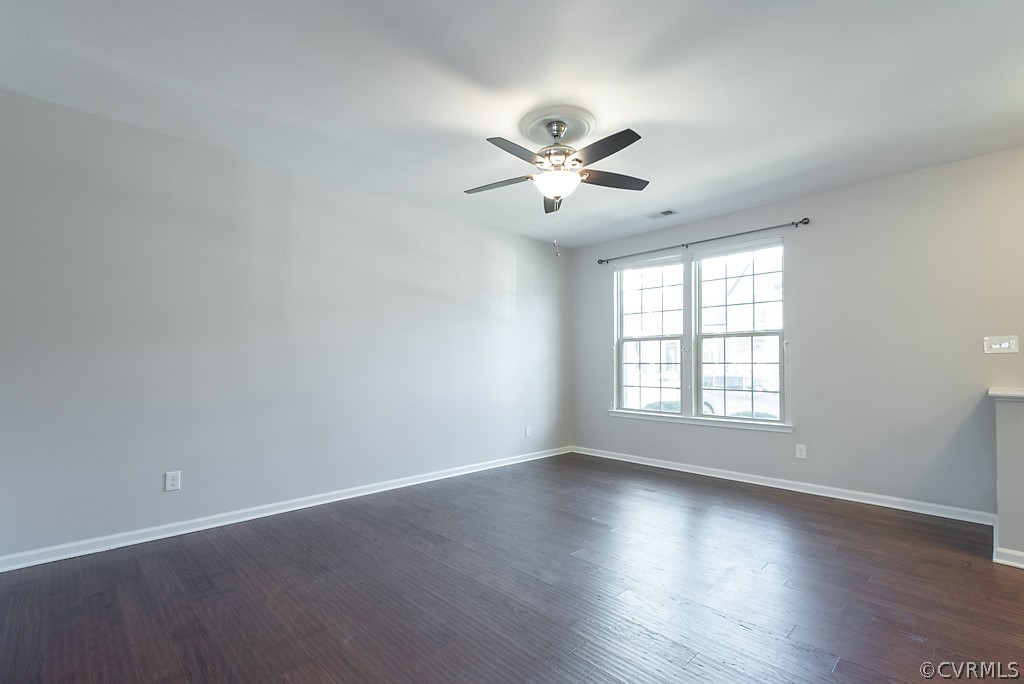5613 Riverside Heights Way Richmond, VA 23225 - Photo 6 of 41 a view of empty room with wooden floor and fan