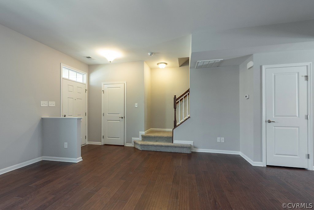 5613 Riverside Heights Way Richmond, VA 23225 - Photo 7 of 41 a view of an empty room with wooden floor