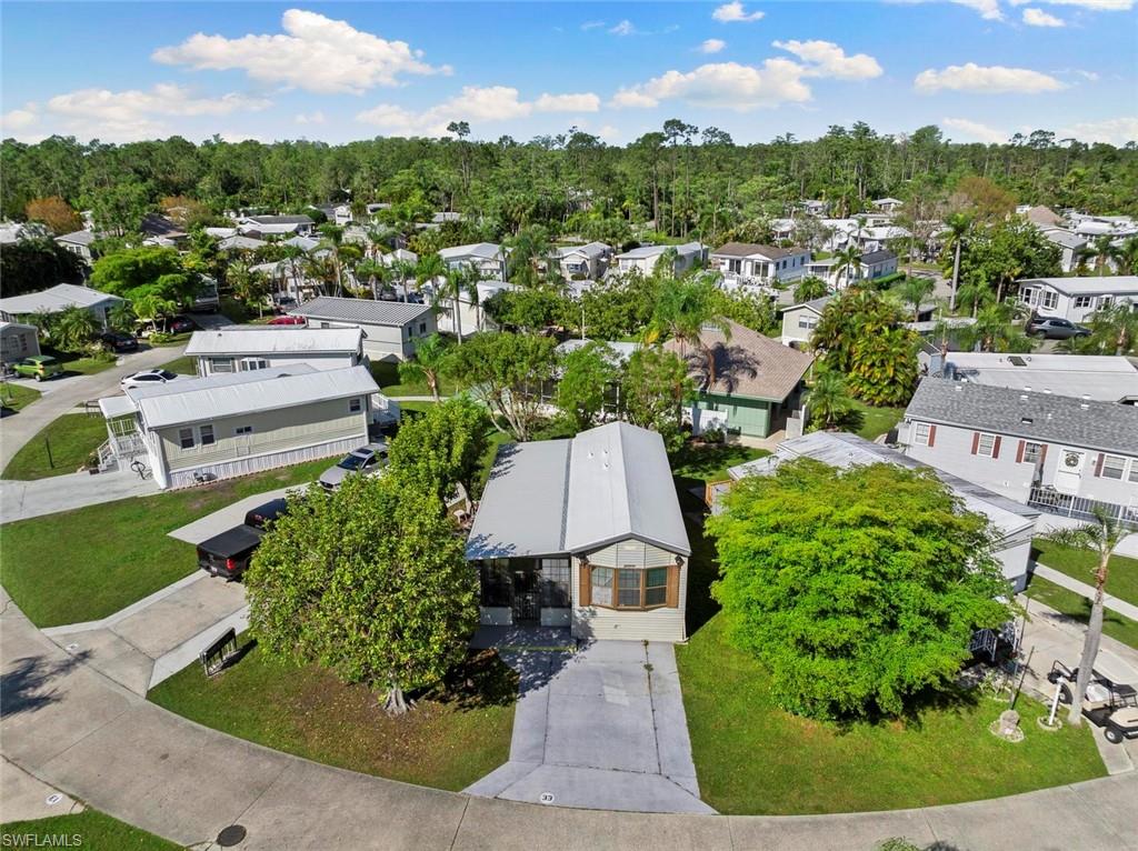 an aerial view of residential houses with outdoor space and garden