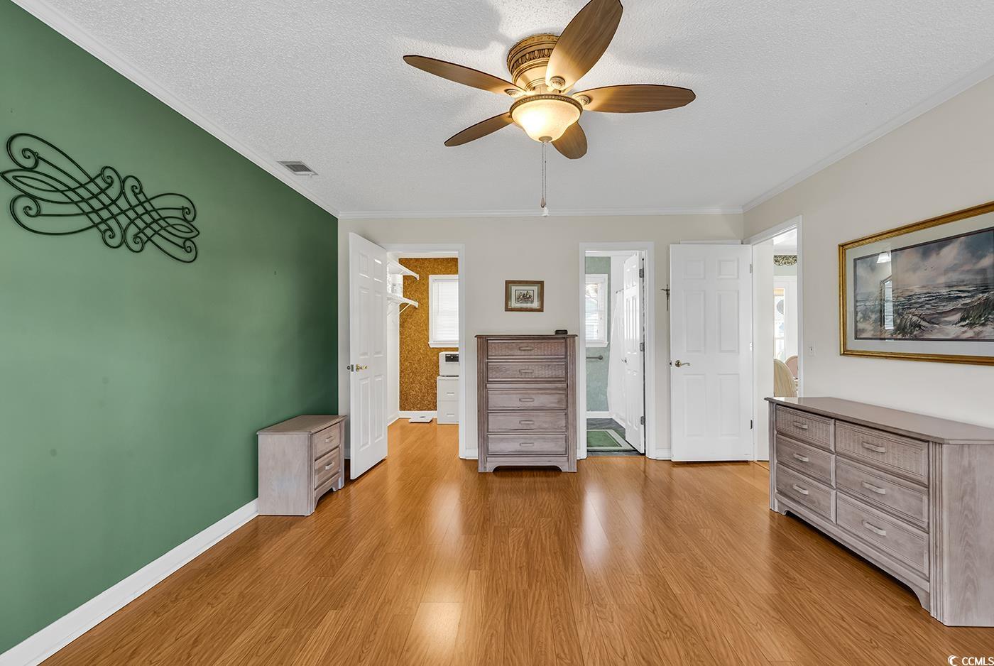 9467 Old Palmetto Road Murrells Inlet, SC 29576 - Photo 8 of 38 Interior space with ensuite bath, a textured ceili