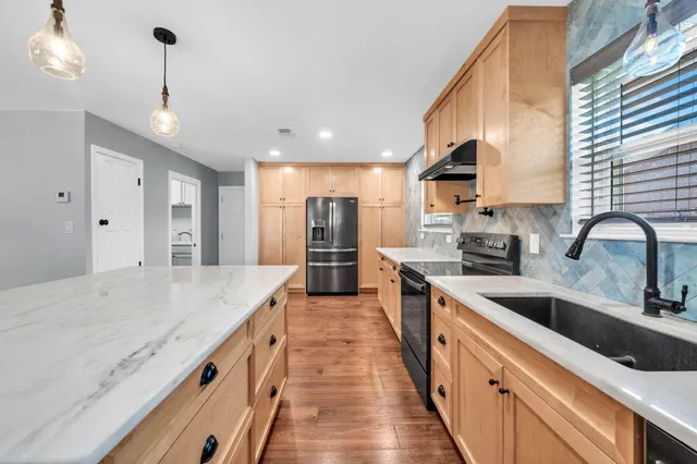 a view of a hallway with a wooden door