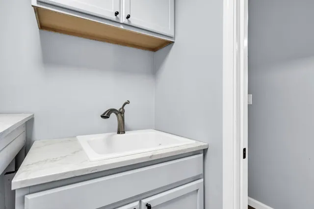 a view of a livingroom with a ceiling fan and window