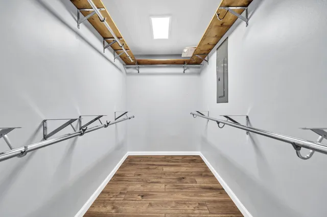 a view of a hallway with a wooden door