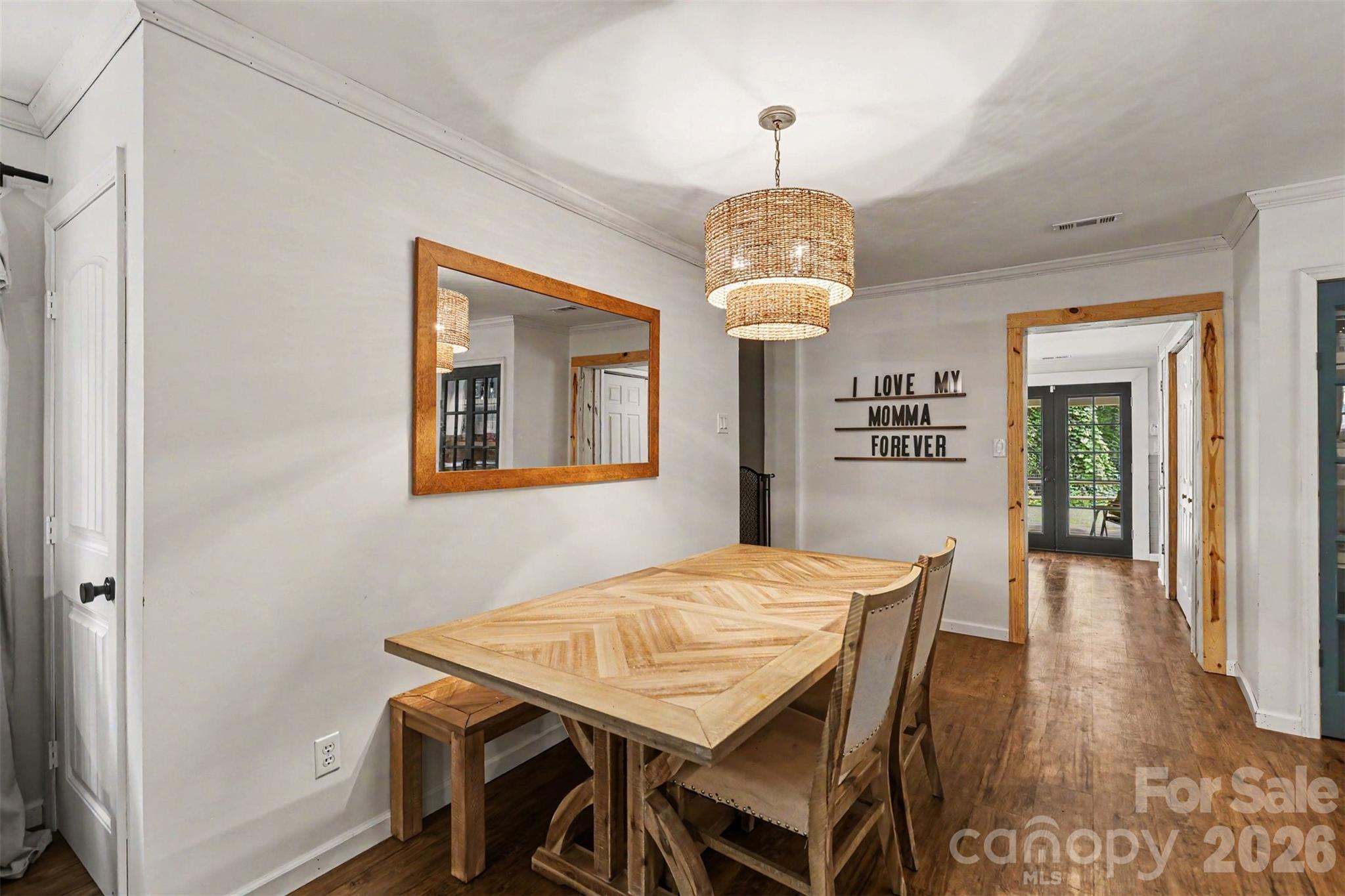 184 Canal Road Belmont, NC 28012 - Photo 24 of 39 a view of a dining room with furniture wooden floor and chandelier