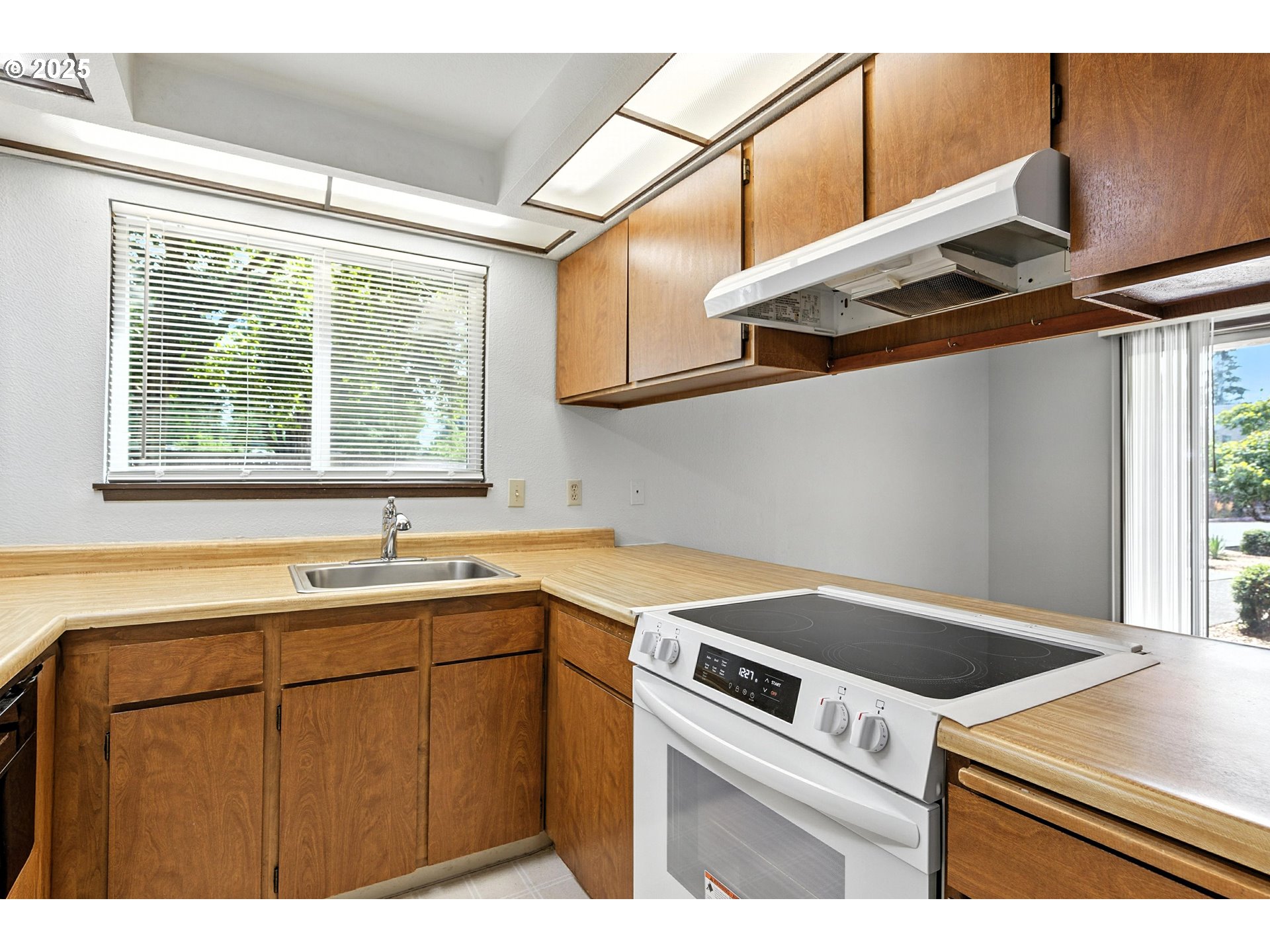3404 19th Avenue, Unit 117 Forest Grove, OR 97116 - Photo 13 of 18 a view of a kitchen with a sink and dishwasher